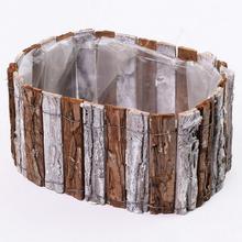 Oválny obal z kôry v prírodnej a bielej farbe.