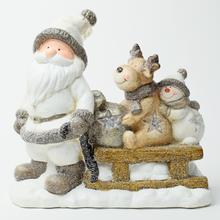Vianočná dekorácia Santa s sane a zvieratkami.