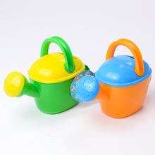 Detská krhlička v zeleno-oranžovej farbe.