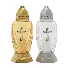 Náhrobné sviečky v čírom skle s krížom.