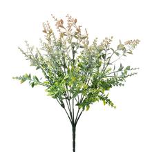 Umelé kvety so zeleno-marhuľovými lístkami.