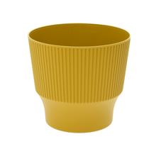 Okrúhly dizajnový kvetináč v limetkovej farbe.