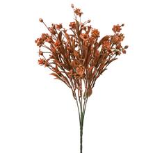 Umelé kvety v zelenej a oranžovej farbe s metalickým efektom.