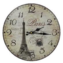 Nástenné hodiny s motívom Paríža, priemer 34 cm.