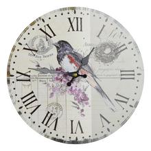 Nástenné hodiny s motívom vtáka, priemer 34 cm.