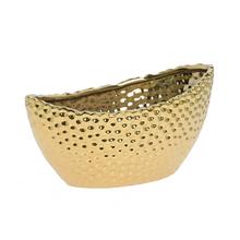 Zlatý keramický obal na kvety s textúrovaným povrchom.