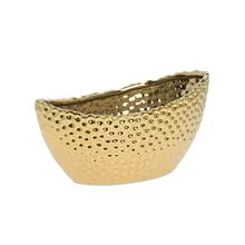 Zlatý keramický obal na kvety s textúrou.