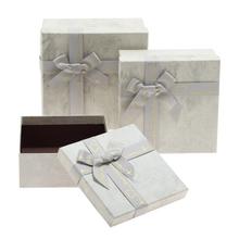 Darčekové krabičky v tvare štvorca s mašľou, tyrkysové.