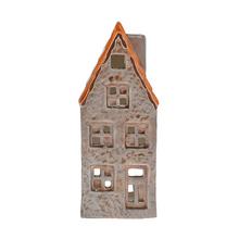 Porcelánový domček na sviečku s oranžovou strechou.