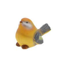 Keramický vtáčik v žltej farbe.