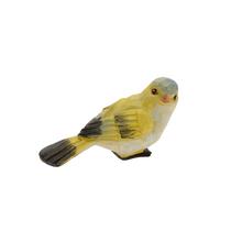 Keramický vtáčik v žltej farbe.