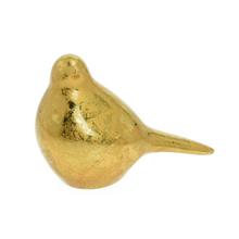 Zlatý vtáčik z keramického materiálu.