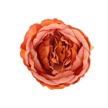 Umelá hlava pivonky v oranžovej farbe s priemerom 7 cm.
