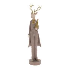 Béžový jeleň s antlers a figúrkou v ruke.