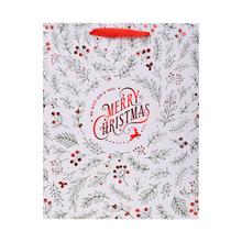 Vianočná taška s kvetinovým vzorom a nápisom Merry Christmas.