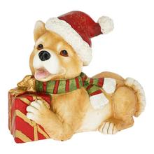 Pes v čiapke Santa s darčekom